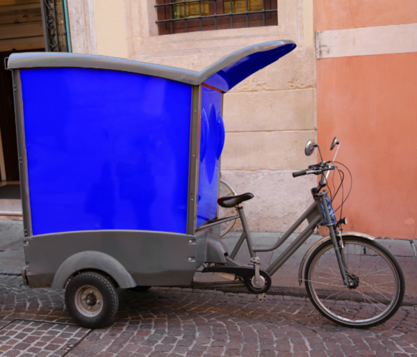 Tricycle cargo e-bike design with enclosed cargo box at the back