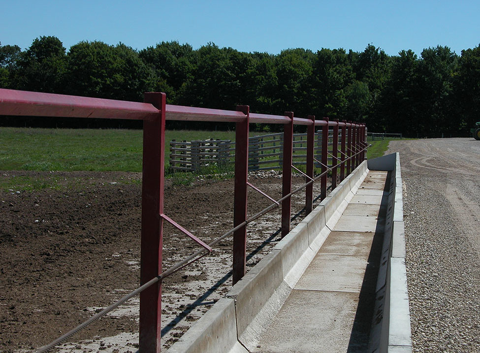 A fence-line feeder used for receiving cattle on a finishing operation.