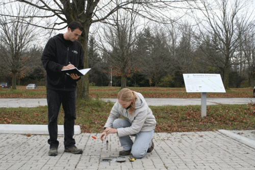 TRCA Sustainable Technologies Evaluation Program staff monitoring the performance of Permeable pavement demonstration plots at the Living City Campus at Kortright