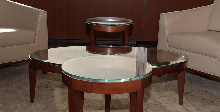 Photo of wood and glass coffee tables centred in the International Room