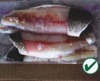 Colour photo of walleye fillets with patch of skin attached in a transparent package. A green checkmark inside a circle is shown on the bottom right of the photo to indicate that it is properly packaged.