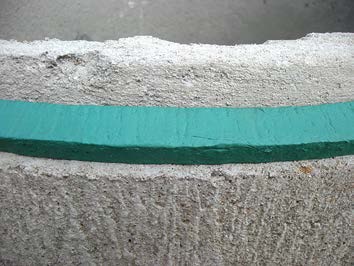 Picture of mastic sealant placed on contrete tile joint - open