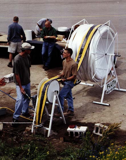 Figure 8-21 shows a photograph of the factory-made installation of a Water FLUTe into a test hole, using the eversion process.