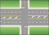 an intersection with marked left-turn lanes