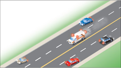 vehicles pulling over to the right to allow emergency vehicle to pass