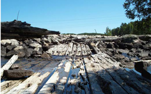 Picture showing abandoned log sluice below weir at the outlet of Mable Lake.