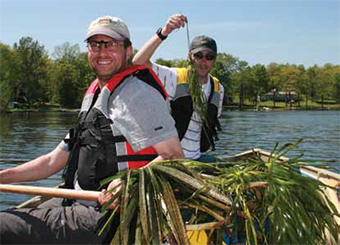 This is a photo of NDMNRF staff collecting water soldier.