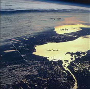 A colour satellite image of smog moving north across Lake Ontario.