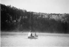 Photo of people in a canoe on a lake