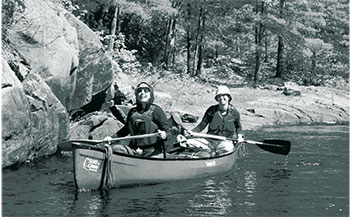 Photo of two people canoing in Kawartha Highlands.