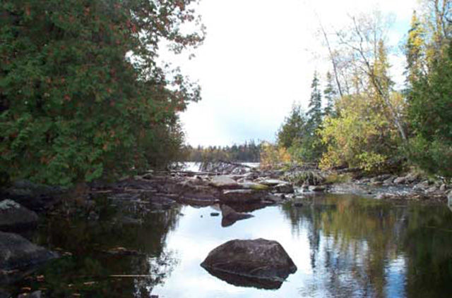This is figure 3 photo displaying the Frypan Portage looking west into NE Lake