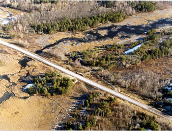 This is an aerial photo showing an old MTO road bed, that provides access to Muskrat Creek .