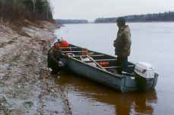 Photo of two men Motorboating near Moose River Crossing.