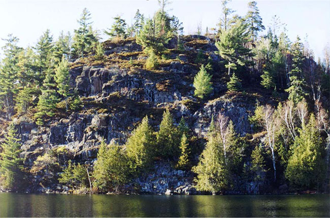 This photo shows Rocky shoreline on west side of Pipestone Lake.