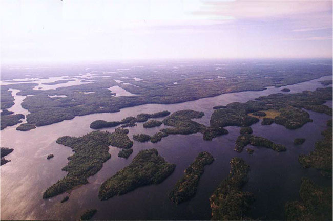This photo shows Aerial view looking southeasterly across islands on Pipestone Lake.