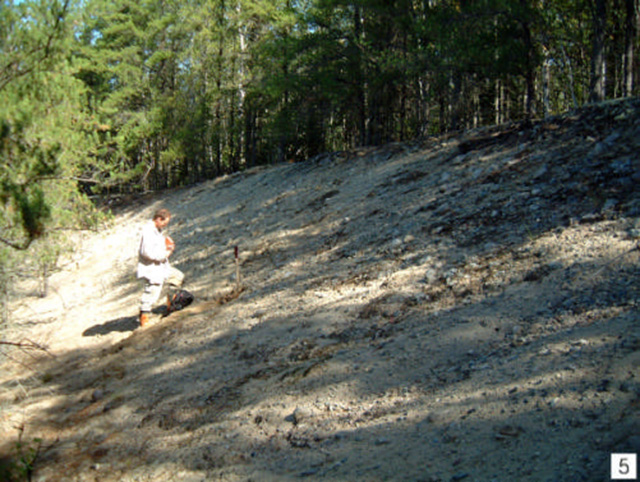 Unbedded, cobble-to sand-sized deposit of probable kame or esker origin. Gravel pit on east side of Sowden Lake forest access road north of the (Stn. 4; UTM 0626538E 5495464N)