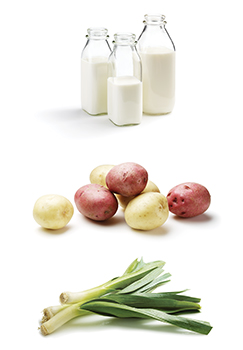 This is an image of milk, potatoes and leeks.