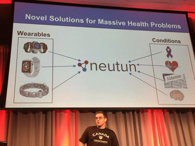 Photo of Eric Dolan, founder of Neutun, with a slide from his business presentation deck in the background.