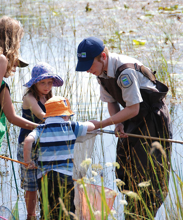 Photo of one of our Ontario Parks staff leading a Natural Heritage Education Program in Ontario Parks.