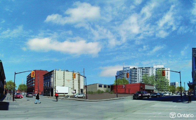 Image of hypothetical site in a downtown before intensification. The image shows vacant land and no pedestrian amenities or landscaping.