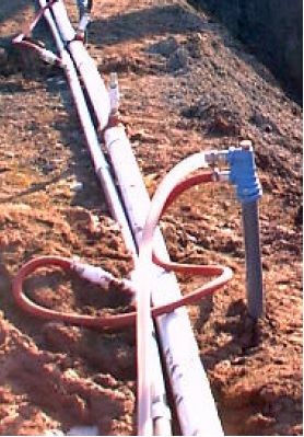 Figure 12-20 is a picture of a eductor well dewatering system with waterlines connected to the top of the casings.