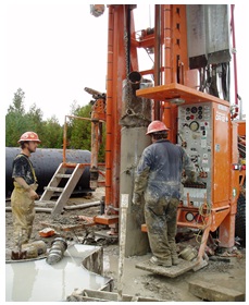 Figure 15-15 shows the removal of well casing using a drilling rig with a chain attached to the rig’s winch.