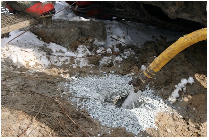 Figure 15-32 shows a licensed well technician periodically adding clean water to the hole shown in Figure 15-31.