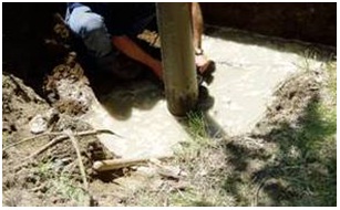 Figure 15-42 shows a licensed well technician removing at least 2 metres (6.6 feet) of well casing from the abandoned well after filling the well with plugging material.