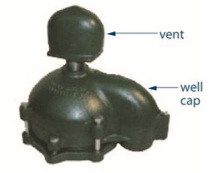Figure 7-5 is an image of a watertight cap with screened air vent above the well cap.