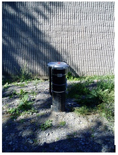 Figure 9-18 is an image of a vented vermin proof cap attached to well casing.