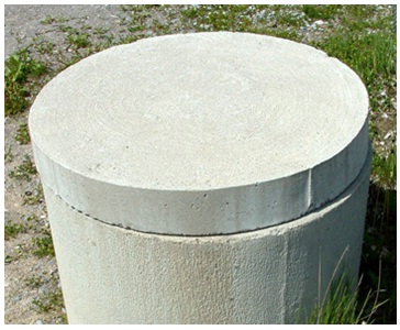This is an image of a concrete dug well with a solid concrete cover.