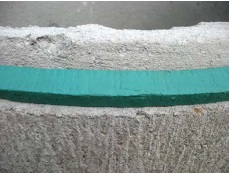 This is an image of a an open mastic sealant placed on concrete tile joint