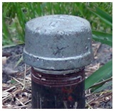 This is an image of an air tight cap threaded onto the top of a casing.