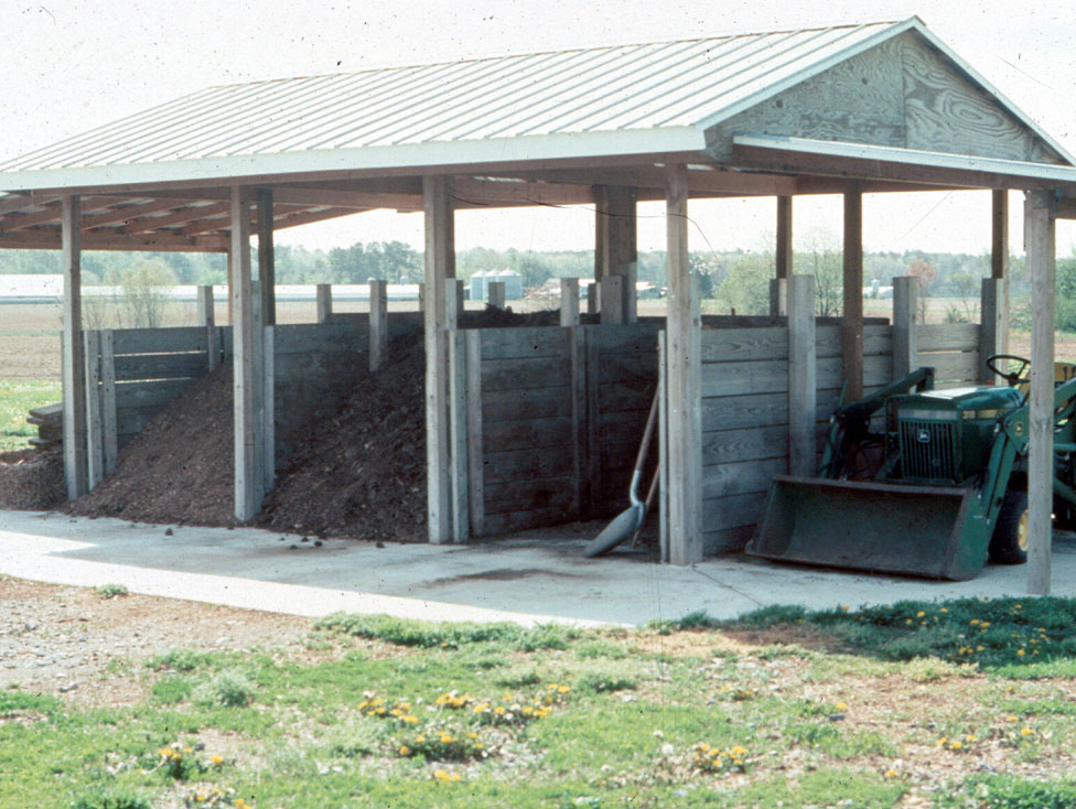 A covered, 3 bunker bin system for composting materials.