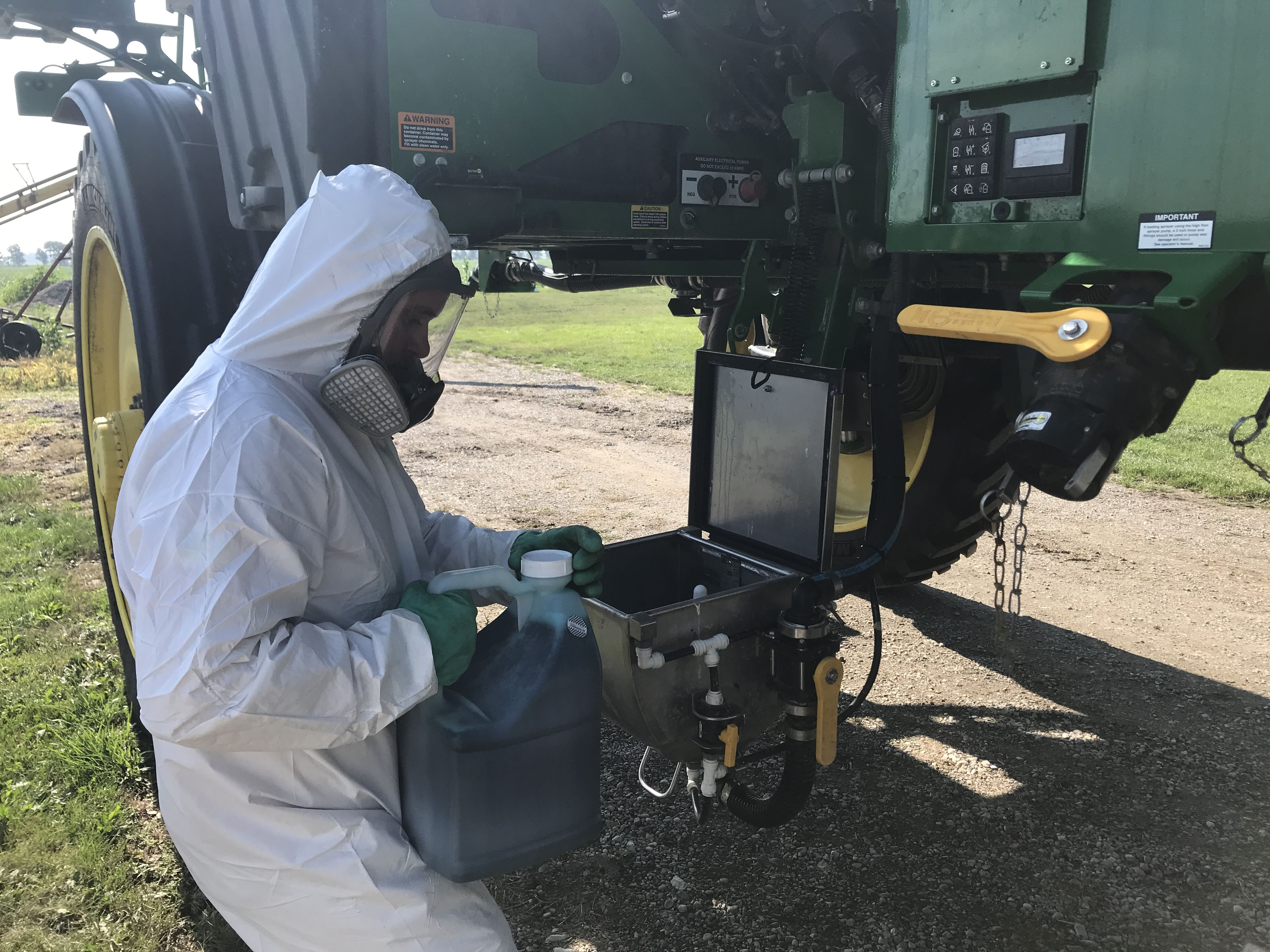 Use proper personal protective equipment when handling pesticides. This sprayer includes a ground-level mixing station to allow easy pesticide loading while minimizing the risk of spills.