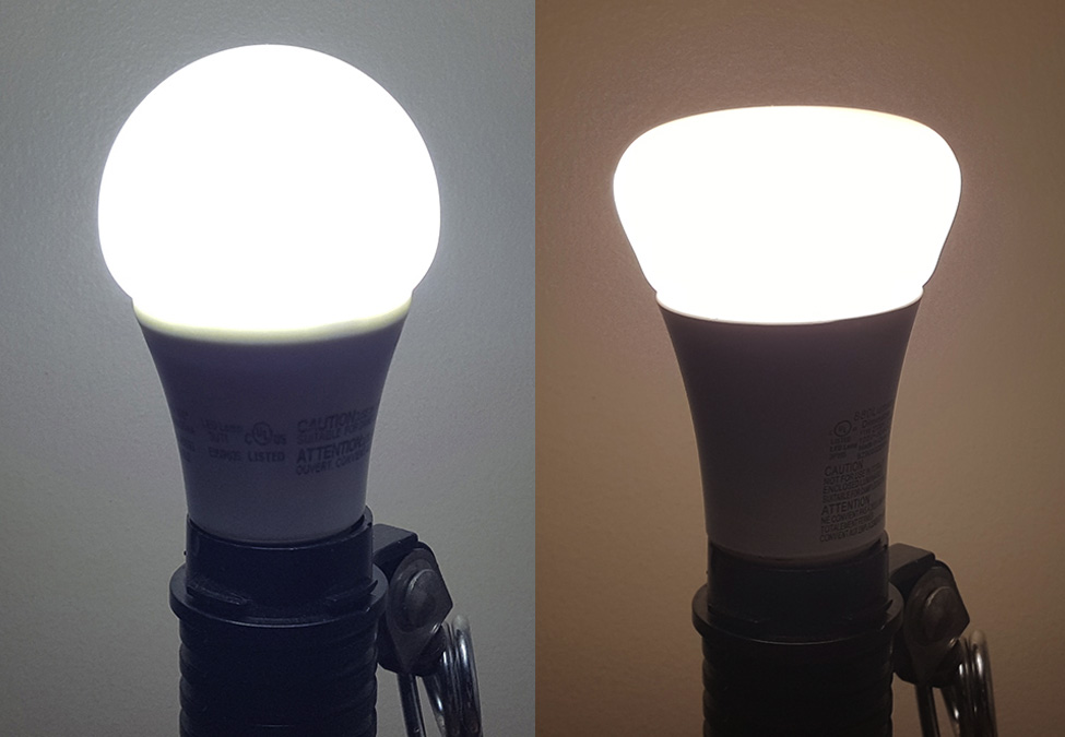 Photo shows an operating A19 LED bulb on the left having a Kelvin rating of 5,000K which is considered the equivalent of noon daylight in direct sun. Photo shows an operating A19 LED bulb on the right having a Kelvin rating of 2,700K which is considered the equivalent of early sunrise or current Incandescent bulbs.