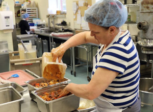 This is a picture of foodservice staff preparing a Beef and Vegetable Stew for hospital patients in the kitchen at Grand River Hospital located in Kitchener. The stew features Ontario beef from VG Meats and Ontario root vegetables from other local farms.