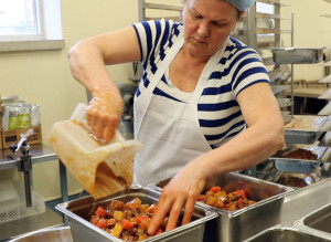This is a picture of foodservice staff preparing a Beef and Vegetable Stew for hospital patients in the kitchen at Grand River Hospital located in Kitchener. The stew features Ontario beef from VG Meats and Ontario root vegetables from other local farms.