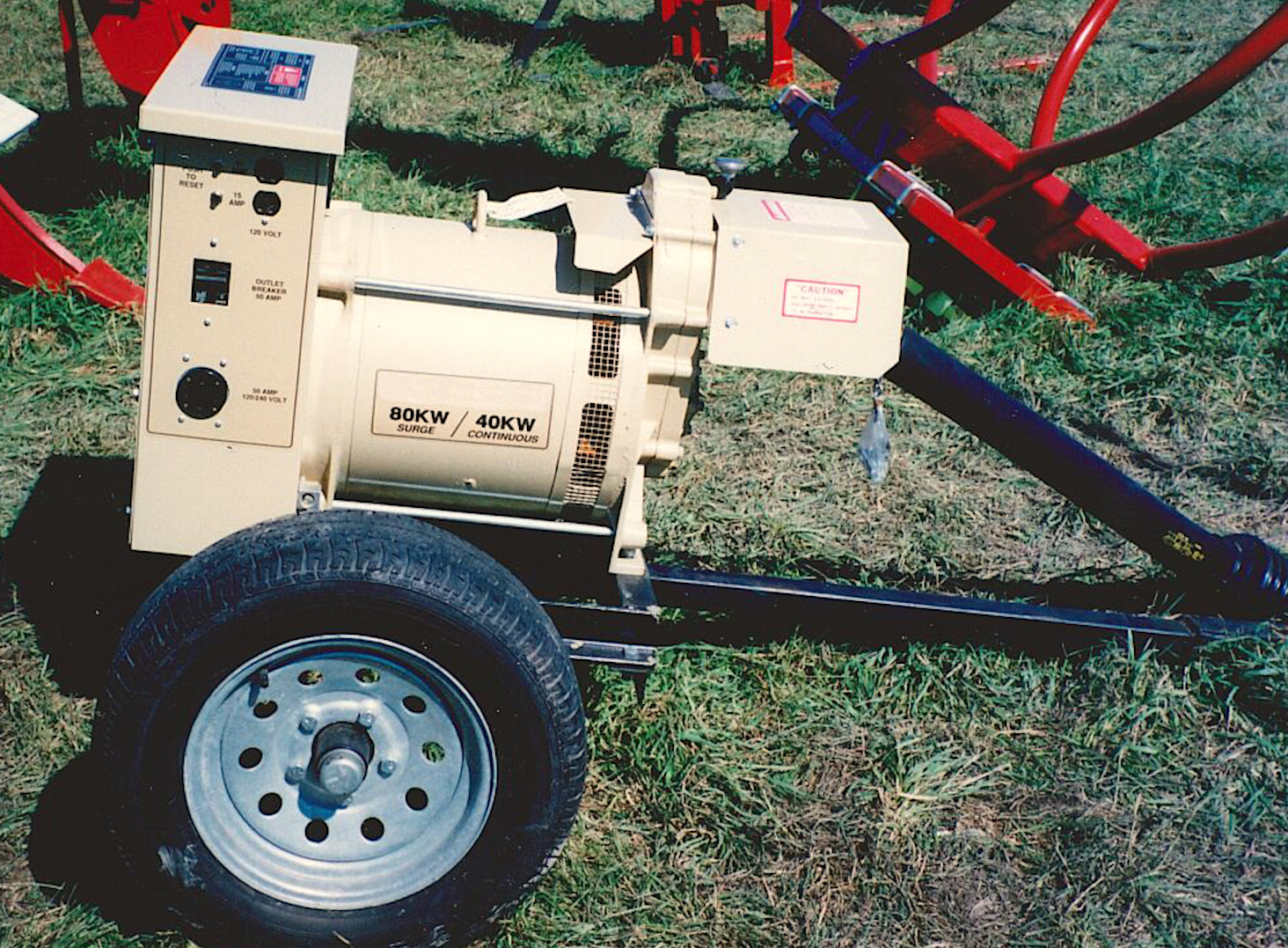 this photo shows a portable generator which is driven by a power take-off shaft from a tractor.