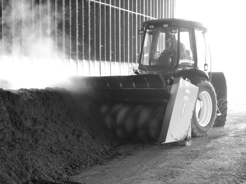 Brown Bear Windrow compost turning unit in action. Windrow created using poultry carcasses and substrate materials.