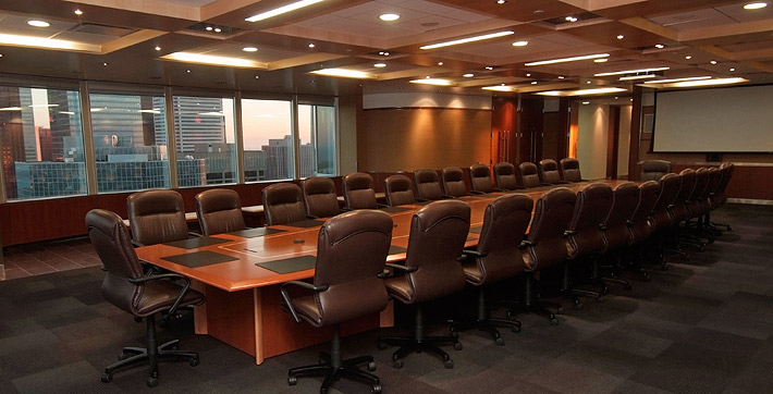 Photo of the Collaboration Boardroom with executive seating for up to 30 people at the table