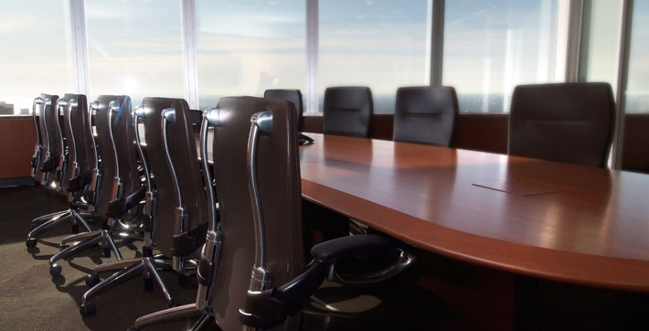 Photo of chairs and table with seating capacity for up to 10 people in the Executive Boardroom