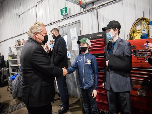 Premier Doug Ford shaking hands with youth